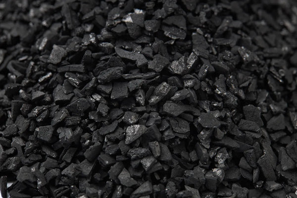 Close-up of granular catalytic carbon water filter media.