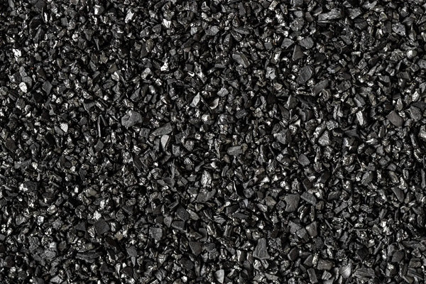 Close up texture of granular activated carbon water filter media