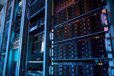 upclose of computers inside data center setting