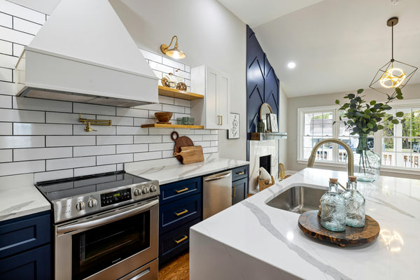 Modern apartment kitchen with an island sink and marble counter where a renter can set up a no-install water filter