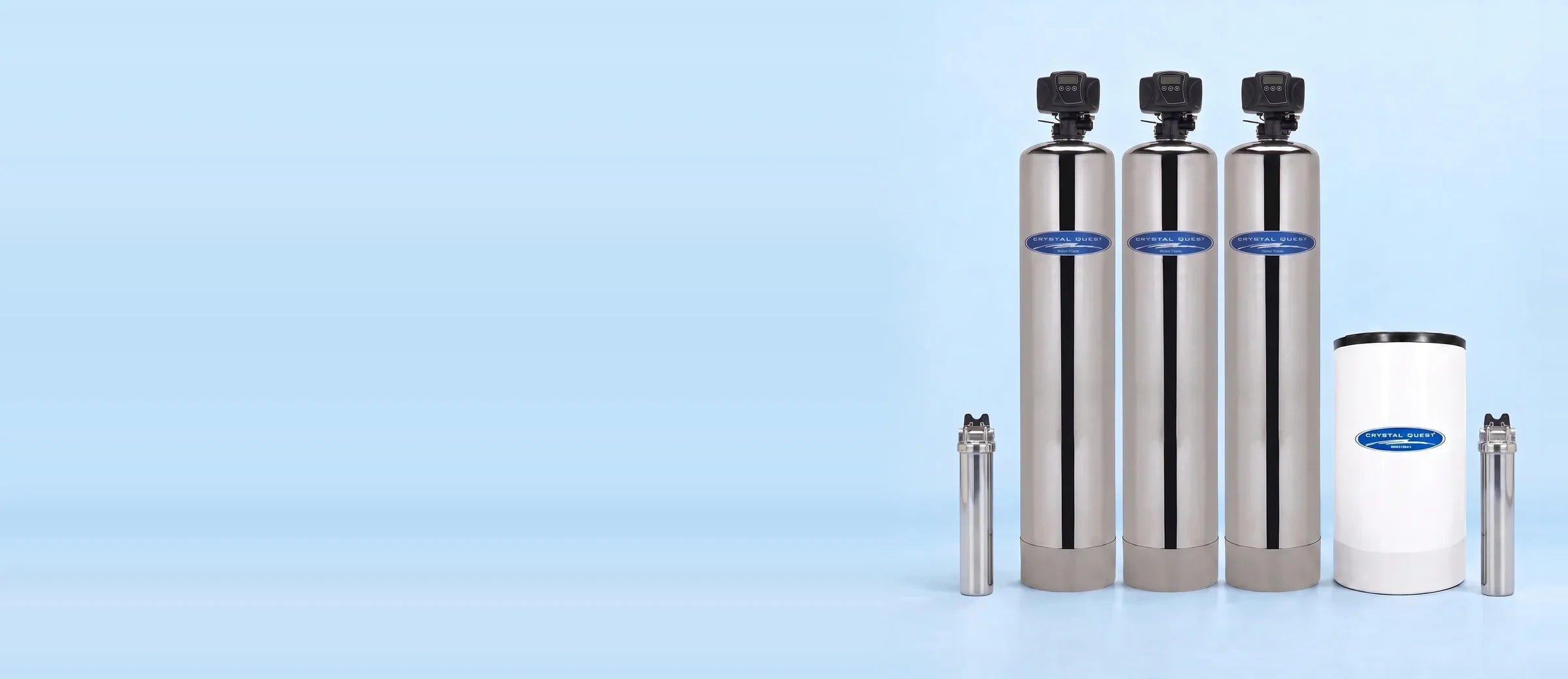 Complete Well Water System in stainless steel: three treatment tanks, a brine tank and two filter housings